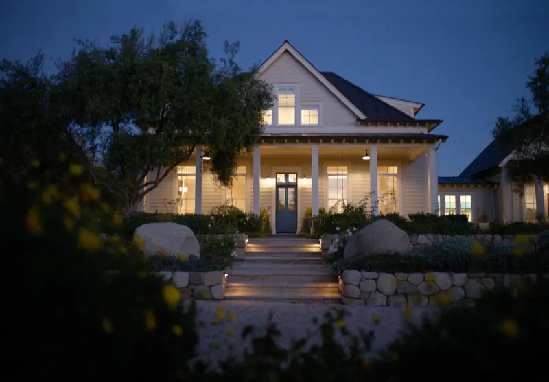Farmhouse-style home at dusk, buy a home in Los Angeles